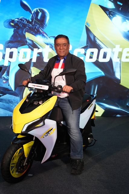 • Segment-leading acceleration: 0-60 km/h in 6.3 seconds • Enhanced safety and control with ABS, Traction Control • SignatureMULTIPOINT® projector headlamps, front combination lamps& ‘T ’-taillamps • Intuitive ride experience with advanced TFT cluster packed with connected features • Experience the smart ride with segment-first Alexa and smartwatch integration • Inspired by stealth aircraft, the scooter embodies futuristic and sporty design First-in-Segment Features • Acceleration (0-60 kmph)- 6.3 seconds • ABS &Traction control SystemMULTIPOINT® Projector Headlamps • Stylish Front Combination Lamps • Race & Street Mode • iGo Assist o ISS – Street Mode Boost – Race Mode • Signature muffler note • Naked Handlebar • Aerodynamic Winglets • Hi-Res TFT cluster with 50+ connected features • 4-way navigation switches • Alexa integration • Smartwatch integration • Vehicle live tracking • Bengaluru, September 8, 2025:TVS Motor Company (TVSM), a global leader in two and three-wheeler segments, has announced the launch of the TVS NTORQ 150, India’s quickestHyper Sport Scooter.Powered by a 149.7cc race-tuned engine and inspired by stealth aircraft design, the scooter is a symphony of high performance, sportier aesthetics and cutting-edge technology to cater to a new generation of riders, with aspecial introductory price of Rs. 119,000 (Ex-showroom, All India) Building on theTVS NTORQ story of always evoking awe, the new scooterwill be yet another icon of tomorrow. Its MULTIPOINT® projector headlamps, aerodynamic winglets, coloured alloy wheels, and signature muffler note highlight its racing DNA, while a hi-res TFT cluster with 50+ smart features, including Alexa and smartwatch integration, live tracking, navigation, and OTA updates makes it the most advanced scooter in its class. Commenting on the launch, Mr. Aniruddha Haldar, Senior Vice President — Head Commuter & EV Business and Head Corporate Brand & Media, TVS Motor Companysaid,“Over two million NTORQians and 50 self-managed ride groups and communities, define the relationship that has been built between one of India’s most loved and iconic automotive brands and its riders. TVS NTORQ has been synonymous with striking design, superior performance and new age technology. The introduction of the all new TVS NTORQ 150,is designed to meet the evolving highperformanceaspirations of the Gen Z!TVS NTORQ 150, India’s first hyper sport scooter with its hyper futuristic design, hyper tuned performance, and hyper connected tech will thrill itsriders, and significantly strengthen and expand the TVS NTORQ brand franchise.” PERFORMANCE The TVS NTORQ 150 is powered by a 149.7cc, air-cooled, O3CTechengine that delivers 13.2 PS at 7,000 rpm and 14.2 Nm torque at 5,500 rpm. Accelerating from 0–60 km/h in just 6.3 seconds and reaching a top speed of 104 km/h, it stands as the quickest scooter in its class. SPORTY & FUTURISTIC DESIGN Inspired by stealth aircraft, the TVS NTORQ 150 features MULTIPOINT®projector headlamps, sporty tail lamps, aerodynamic winglets, a stubby muffler with signature sound, naked handlebar, and coloured alloy wheels. • Forward-biasedstance with aggressive, predatory launch-ready poise. • Arrowhead front form sculpted for aerodynamic efficiency and visual speed. • Naked motorcycle-style handlebar, enhancing rider control and delivers a raw, connected feel. • Jet-inspired vents and integrated winglets, reinforcing its race-bred identity. • MULTIPOINT®projector headlamps offering superior illumination. • Signature ‘T’ taillamp, distinct and designed for enhanced visibility. • Gaming console-inspired hi-res TFT. • Sport-tuned suspension, lightweight alloys, and a performance exhaust that visually and functionally anchor its sporty character. TECH-PACKED FOR THE NEW-AGE RIDER Equipped with a hi-res TFT cluster and TVS SmartXonnect™, the TVS NTORQ 150 offers 50+ connected features including Alexa and smartwatch integration, turn-by-turn navigation, vehicle tracking, last parked location, call/message/social media alerts, ride modes, OTA updates, and custom widgets. The adaptive TFT display with 4-way navigation switch and integrated telematics makes it India’s most advanced scooter interface. SAFETY & COMFORT The scooter ensures rider confidence with ABS and traction control (first-in-segment), crash and theft alerts, hazard lamps, emergency brake warning, and follow-me headlamps. Comfort is enhanced through telescopic suspension, adjustable brake levers, a patented E-Z center stand, and 22L under-seat storage. COLOUR PALLETTE The TVS NTORQ 150 will be offered in two variants: • TVS NTORQ 150 – Stealth Silver, Racing Red, Turbo Blue • TVS NTORQ 150 with TFT Cluster – Nitro Green, Racing Red, Turbo Blue